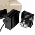Black metal heat sinks with a light bulb on a white background